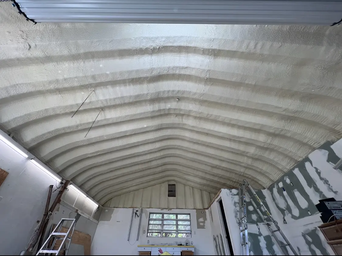 Spray polyurethane foam applied to the underside of a metal roof deck in Odessa